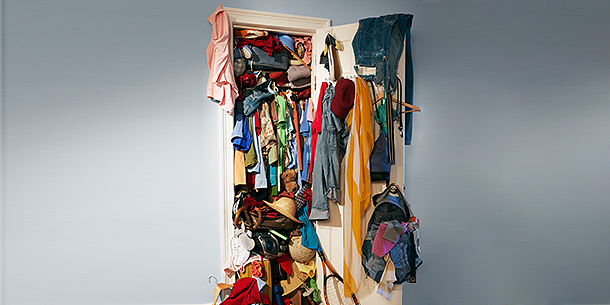 Closet Overflowing With Clothes